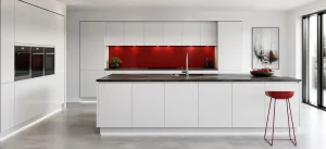 Modern fitted kitchen with aligned cabinets and a polished showroom finish
